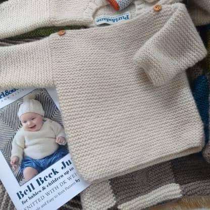 baby sweater knitting pattern in easy garter stitch - laid out falt view 